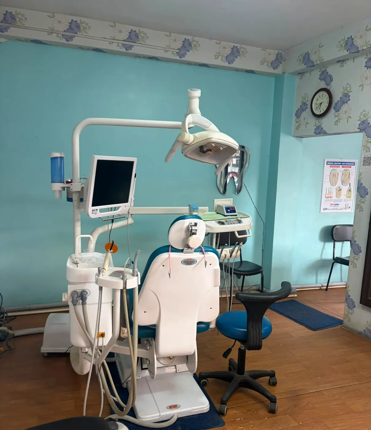 Dental chair, operating light and instrument tray at Gurjudhara Dental Care, Chandragiri-12